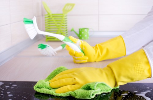 Local cleaner preparing an Airbnb bedroom for the next guest in SE27